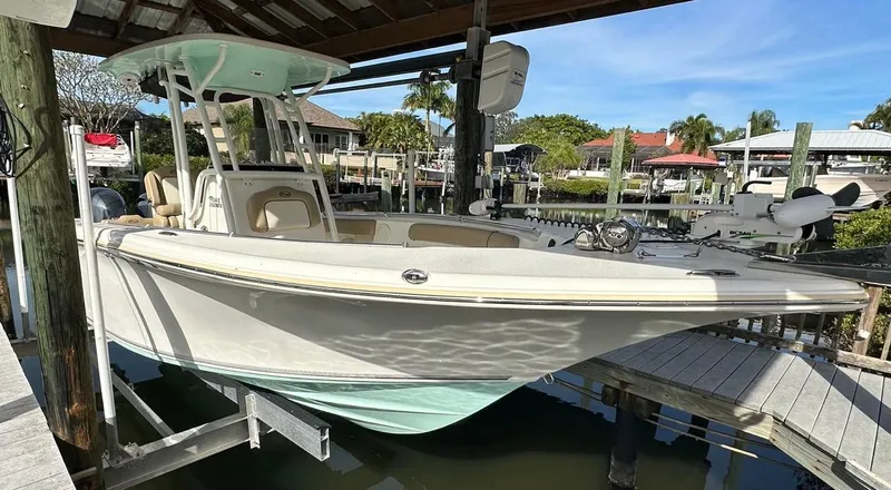 Slide: The Image of 2019 Key West 244 Center Console boat docked in a marina. - 6