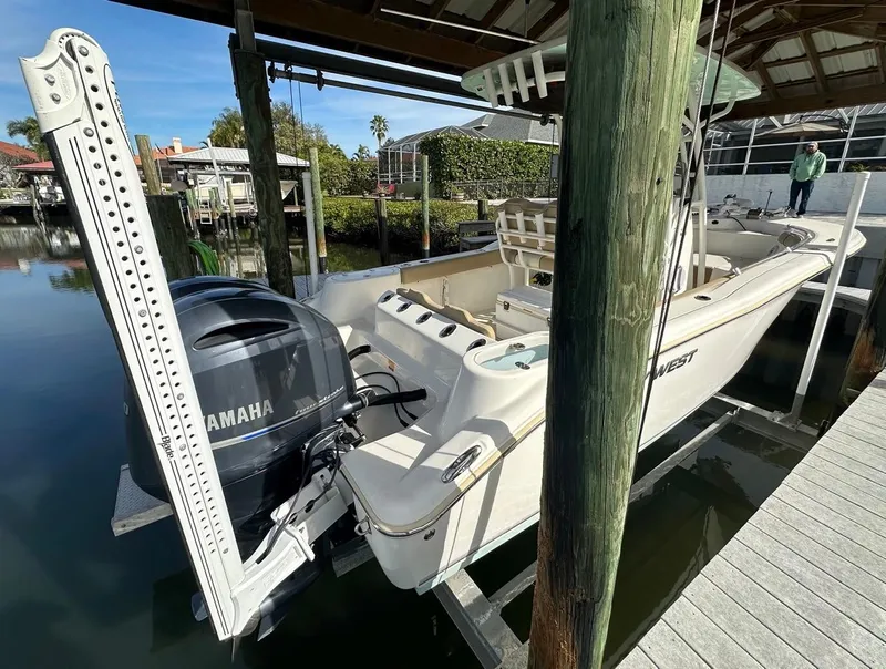 Slide: The Image of 2019 Key West 244 Center Console boat with Yamaha engine docked in marina. - 9
