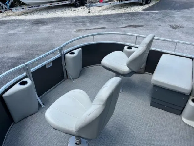 Slide: The Image of 2023 SunChaser Vista 18 Fish pontoon boat interior with seating and storage. - 6