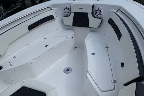 Slide: The Image of 2025 Tidewater 220 CC Adventure boat interior with seating and speakers. - 10