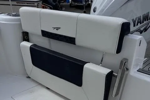 Slide: The Image of 2025 Tidewater 220 CC Adventure boat seat with Yamaha engine in background. - 14