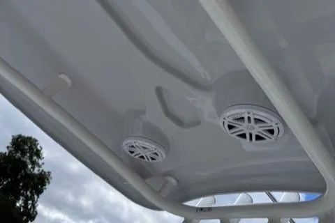 Slide: The Image of Tidewater 220 CC Adventure 2025 boat speakers and canopy detail. - 16
