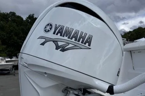 Slide: The Image of Yamaha outboard motor on 2025 Tidewater 220 CC Adventure boat, cloudy sky background. - 20