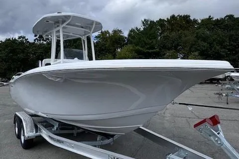 Slide: The Image of 2025 Tidewater 220 CC Adventure boat on trailer, parked outdoors. - 3