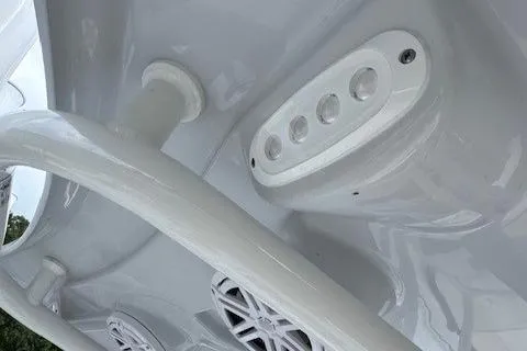 Slide: The Image of Close-up of 2025 Tidewater 220 CC Adventure boat's interior features and speakers. - 8