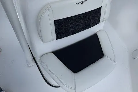 Slide: The Image of Tidewater 220 CC Adventure 2025 boat seat with black and white upholstery. - 9
