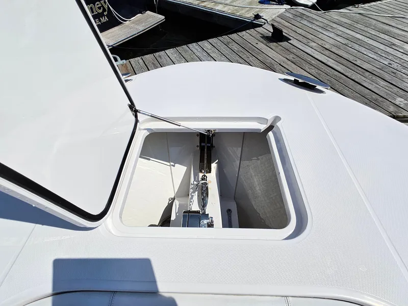 Slide: The Image of Open anchor hatch on 2022 Southport 30 FE boat at dock. - 12