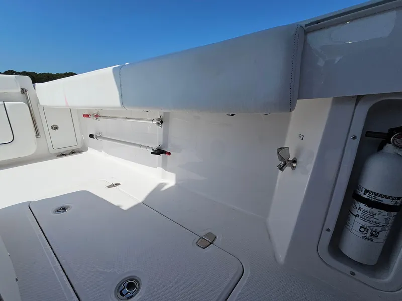 Slide: The Image of 2022 Southport 30 FE boat interior with storage and safety equipment. - 14