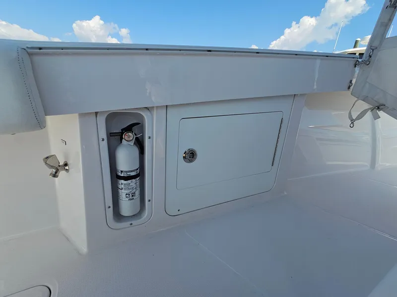 Slide: The Image of 2022 Southport 30 FE boat deck with fire extinguisher and storage compartment. - 15