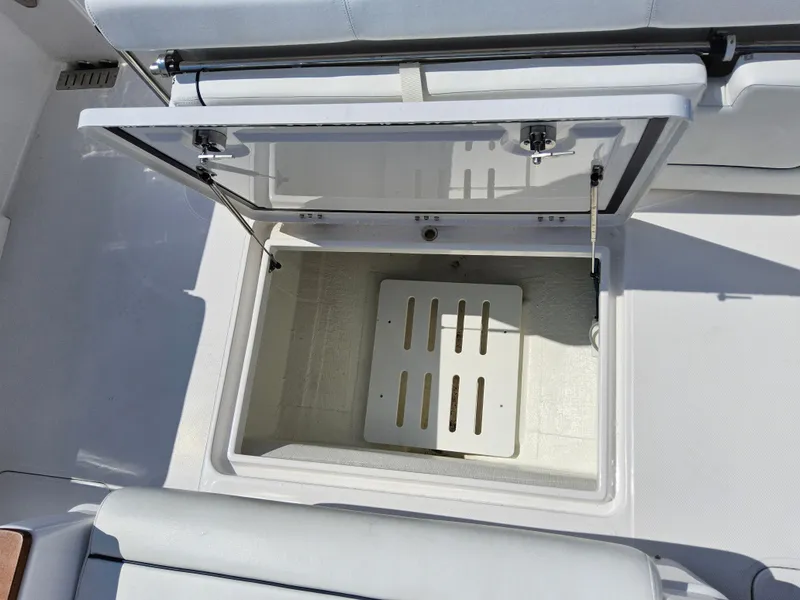 Slide: The Image of Open storage compartment on 2022 Southport 30 FE boat. - 16