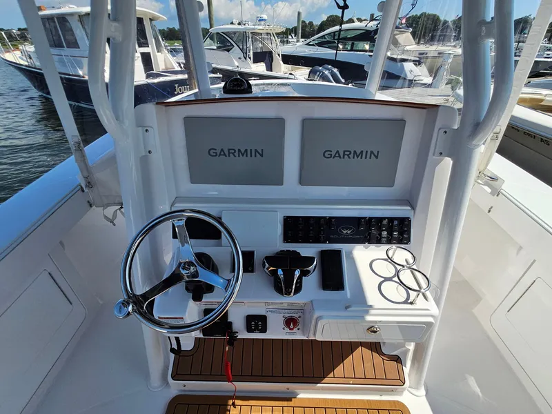 Slide: The Image of 2022 Southport 30 FE boat console with dual Garmin displays and steering wheel. - 9