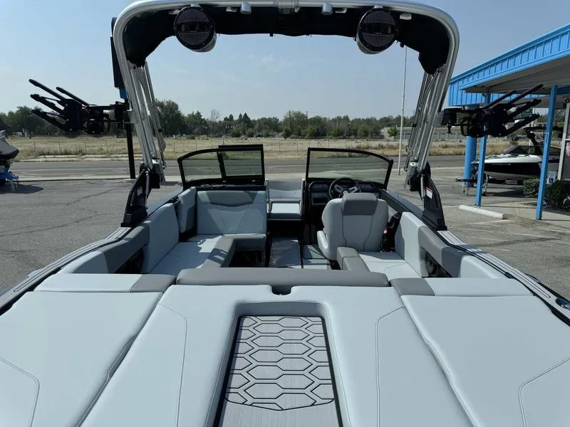 Slide: The Image of 2025 MasterCraft NXT22 boat interior with modern seating and sleek design. - 6