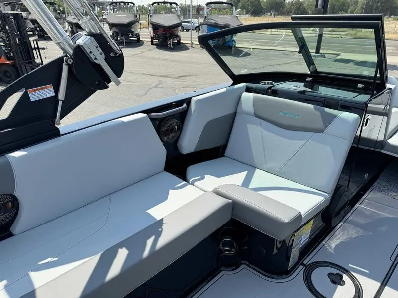 Slide: The Image of 2025 MasterCraft NXT22 boat interior with sleek seating and modern design. - 8
