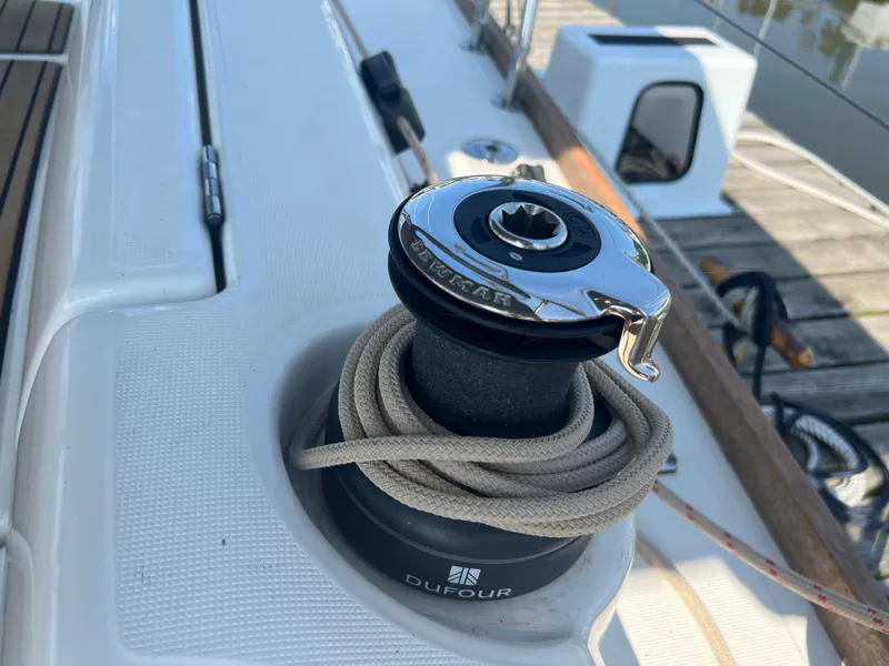 Slide: The Image of Dufour 360 sailboat winch with rope, 2021 model, docked at marina. - 11