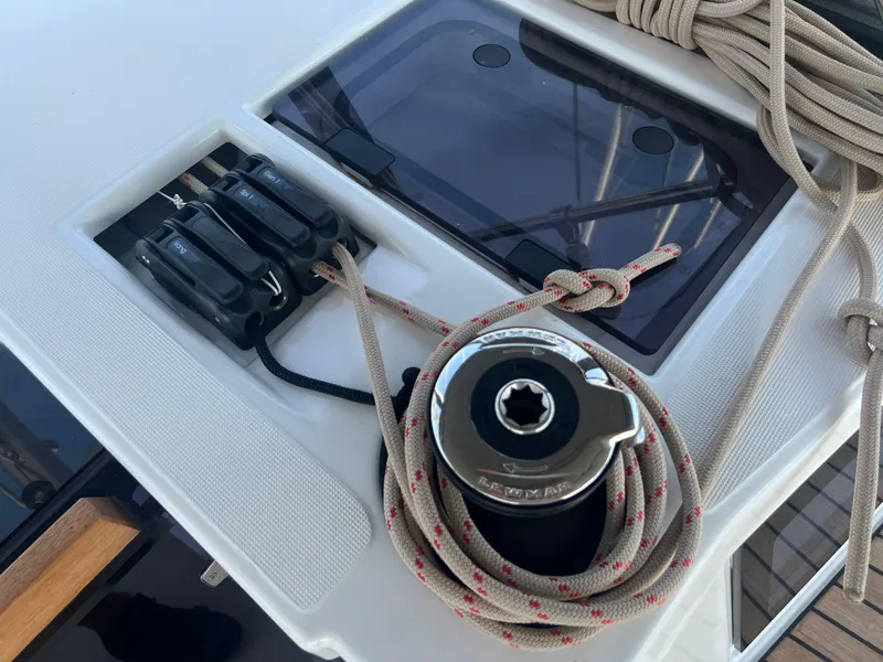 Slide: The Image of Dufour 360 sailboat deck with winch and ropes, 2021 model. - 13