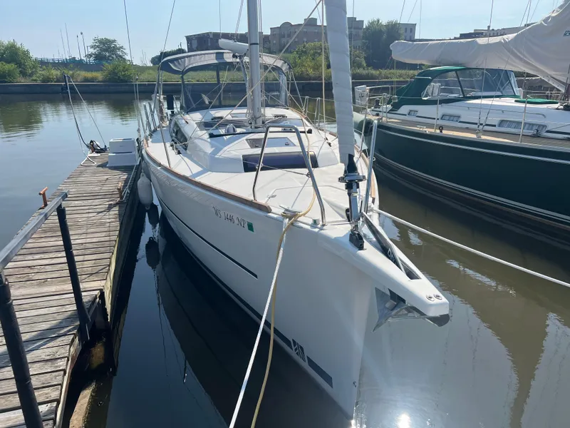 Slide: The Image of 2021 Dufour 360 sailboat docked in a marina, sunny day. - 2