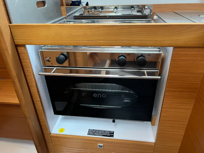 Slide: The Image of Modern kitchen oven in 2021 Dufour 360 yacht interior. - 27