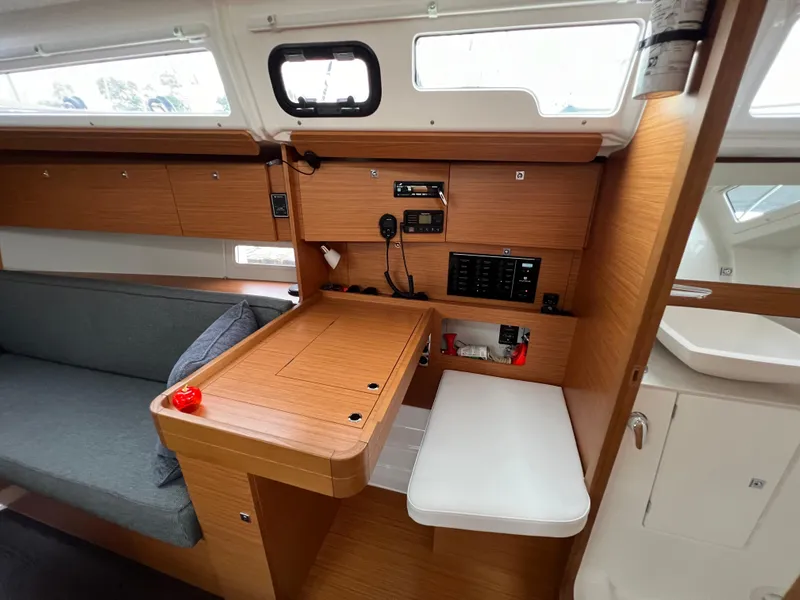 Slide: The Image of Interior of 2021 Dufour 360 sailboat with wooden cabinetry and seating area. - 31