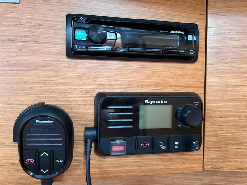 Slide: The Image of Raymarine and Alpine equipment on 2021 Dufour 360 yacht's wooden dashboard. - 32