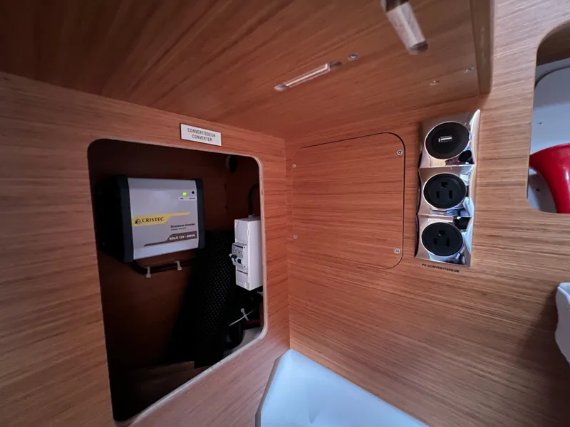 Slide: The Image of Interior of 2021 Dufour 360 yacht showing electrical panel and outlets. - 34