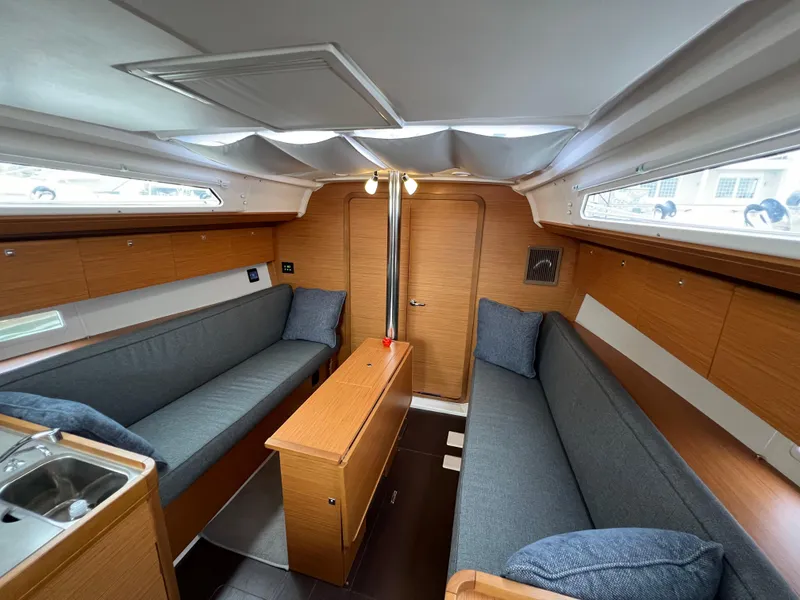 Slide: The Image of Interior of 2021 Dufour 360 sailboat with cozy seating and wooden finishes. - 39