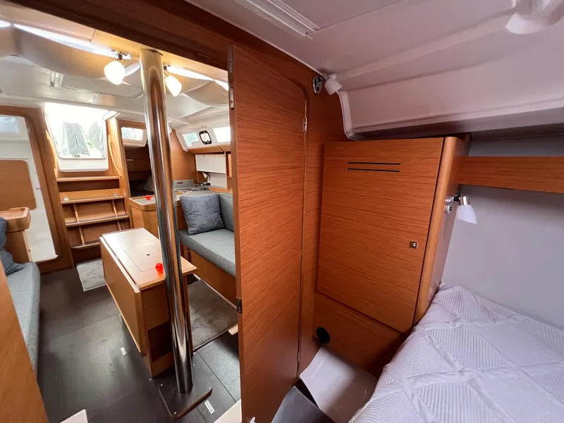 Slide: The Image of Interior of 2021 Dufour 360 sailboat, featuring cozy wood finish and modern design. - 44