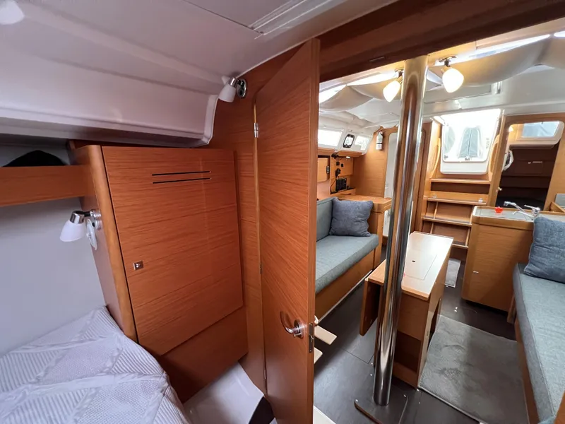 Slide: The Image of Interior of 2021 Dufour 360 yacht, featuring cozy wooden furnishings and modern design. - 45