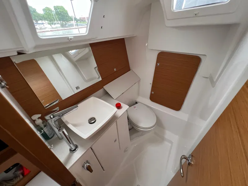 Slide: The Image of Modern bathroom in 2021 Dufour 360 yacht with sink, toilet, and wooden accents. - 48