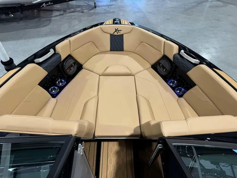 Slide: The Image of Luxurious interior of 2025 MasterCraft XT23 boat with tan seating and modern design. - 7