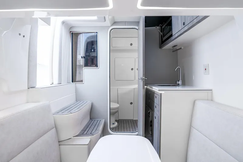 Slide: The Image of 2024 SeaVee 450z interior with modern kitchenette and seating area. - 7