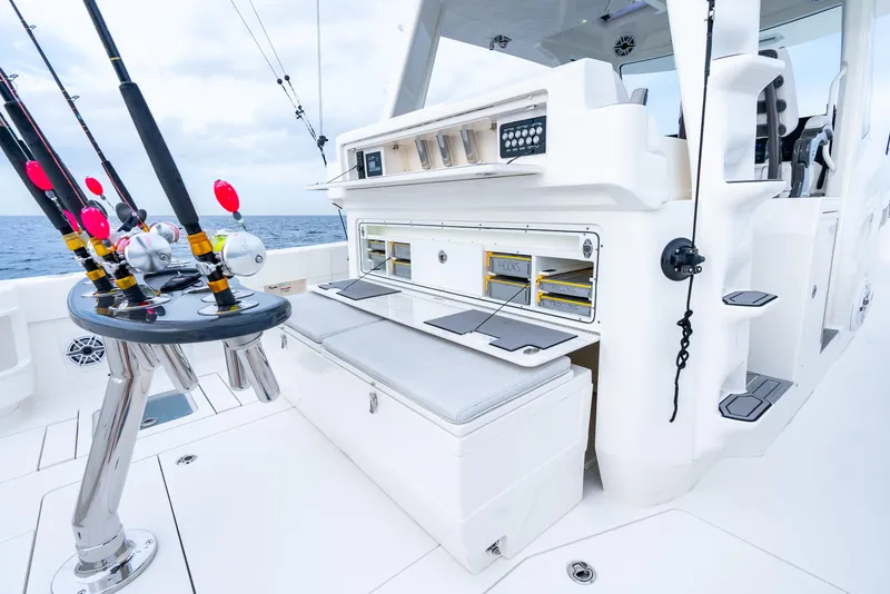 Slide: The Image of 2024 SeaVee 450z fishing boat deck with rods and storage compartments. - 8