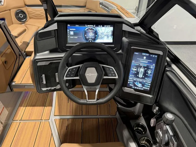 Slide: The Image of 2025 Supra SE boat dashboard with advanced digital displays and luxurious interior design. - 11