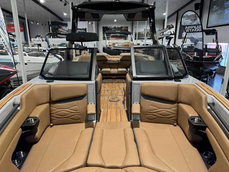 Slide: The Image of 2025 Supra SE boat interior with luxurious tan leather seating and modern design. - 7