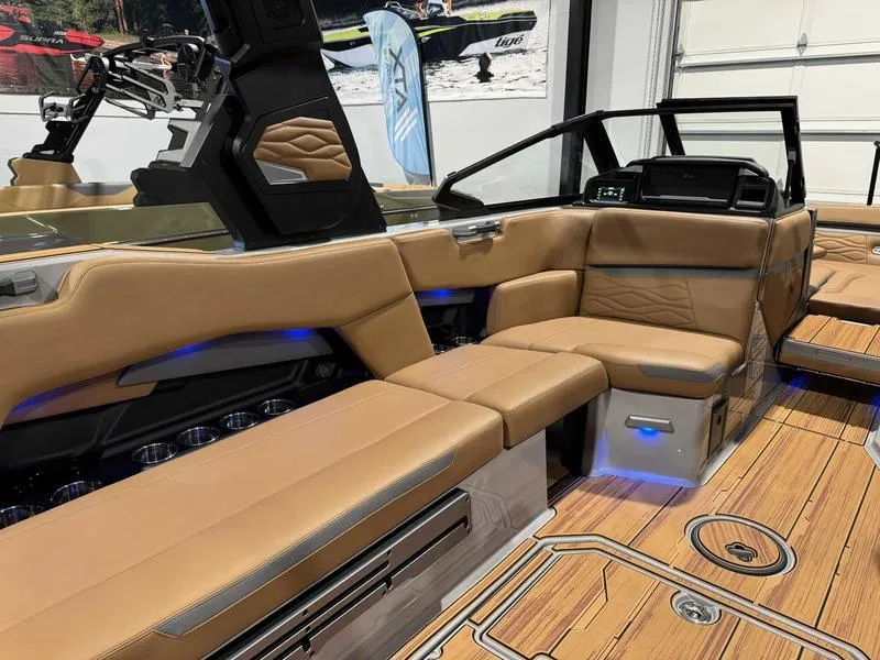 Slide: The Image of 2025 Supra SE boat interior with tan leather seating and modern design elements. - 8