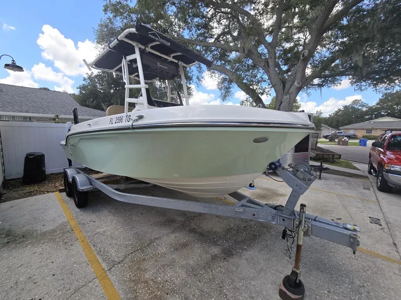 Slide: The Image of 2022 Bayliner Trophy T20CC boat on trailer in parking lot. - 1