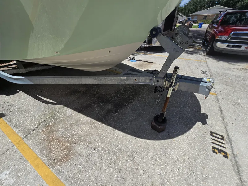 Slide: The Image of 2022 Bayliner Trophy T20CC boat on trailer in parking lot. - 10