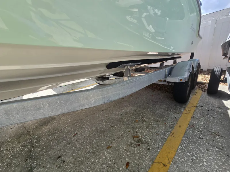 Slide: The Image of 2022 Bayliner Trophy T20CC boat on trailer, side view. - 15