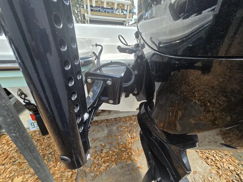 Slide: The Image of Close-up of 2022 Bayliner Trophy T20CC boat motor and mounting bracket. - 28