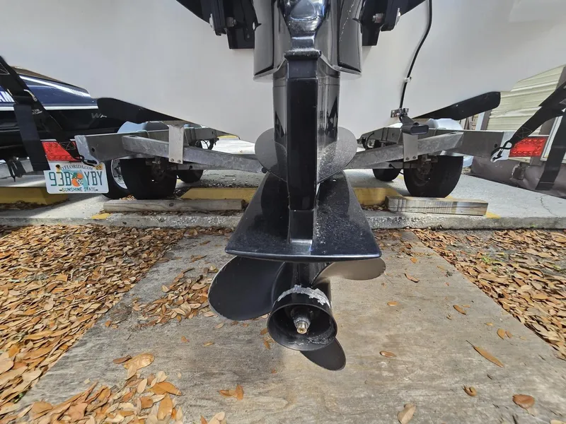Slide: The Image of 2022 Bayliner Trophy T20CC boat propeller and trailer close-up. - 30
