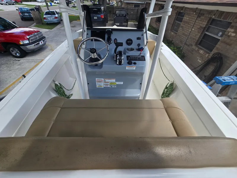 Slide: The Image of 2022 Bayliner Trophy T20CC boat interior with steering wheel and controls. - 36