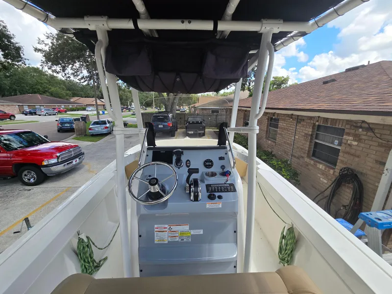 Slide: The Image of 2022 Bayliner Trophy T20CC boat interior with steering console and controls. - 38