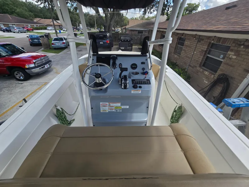 Slide: The Image of 2022 Bayliner Trophy T20CC boat interior with steering console and seating. - 39