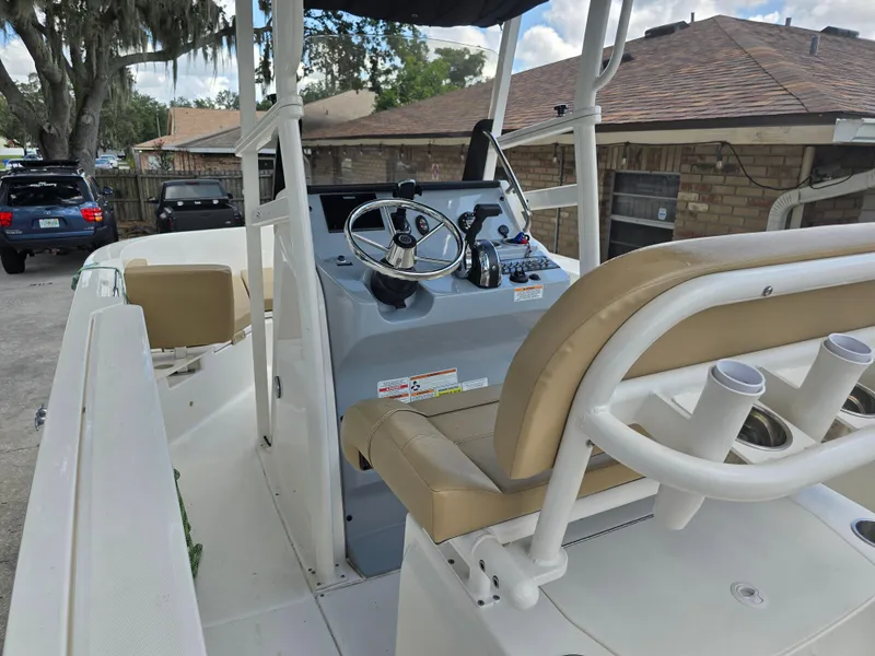 Slide: The Image of 2022 Bayliner Trophy T20CC boat interior with steering console and seating. - 40