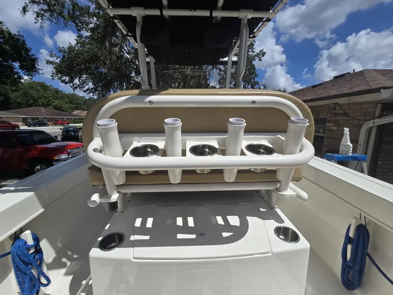 Slide: The Image of 2022 Bayliner Trophy T20CC boat interior with rod holders and storage. - 42