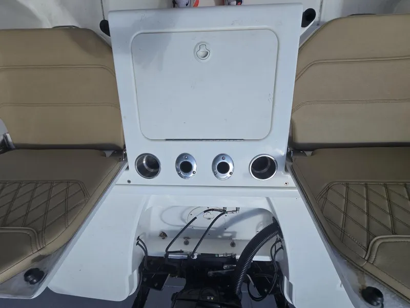 Slide: The Image of 2022 Bayliner Trophy T20CC boat interior with beige seating and storage compartment. - 45