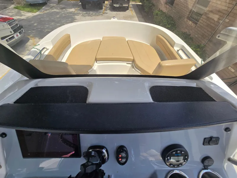 Slide: The Image of 2022 Bayliner Trophy T20CC boat interior with dashboard and seating area. - 47