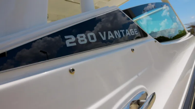 Slide: The Image of 2024 Boston Whaler 280 Vantage boat exterior detail with logo. - 14