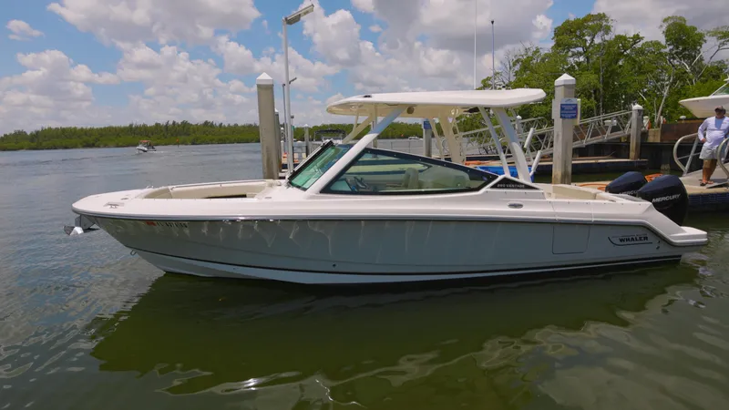 Slide: The Image of 2024 Boston Whaler 280 Vantage boat docked on a sunny day. - 16
