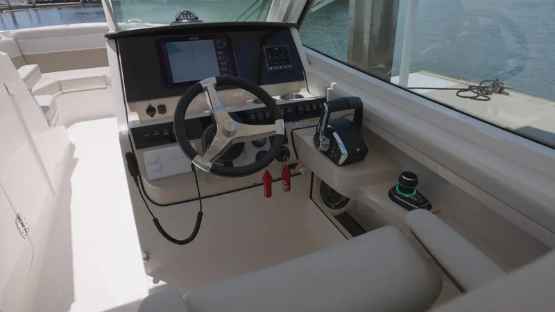 Slide: The Image of 2024 Boston Whaler 280 Vantage helm with modern controls and navigation system. - 2