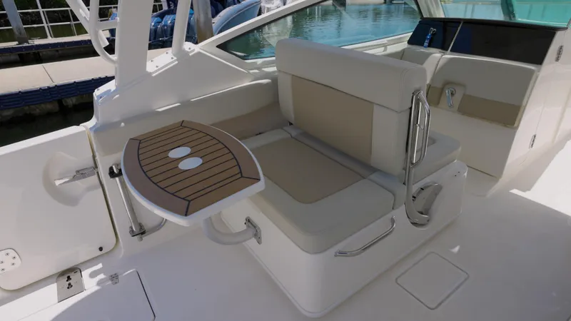 Slide: The Image of 2024 Boston Whaler 280 Vantage boat interior with seating and table. - 9
